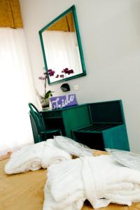 Postel nebo postele na pokoji v ubytování Hotel Iride & Spa