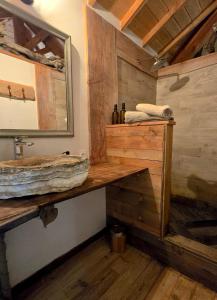 a bathroom with a sink and a mirror at ALPINEST - Les Cabanes du Pas de la Louve in Serres +61 photos