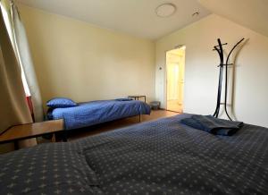 Postel nebo postele na pokoji v ubytování Meierei kohviku majutus