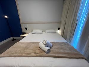 Postel nebo postele na pokoji v ubytování Hotel Ibirapuera Moema UH2003