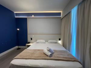 Postel nebo postele na pokoji v ubytování Hotel Ibirapuera Moema UH2003