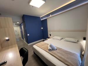 Postel nebo postele na pokoji v ubytování Hotel Ibirapuera Moema UH2003