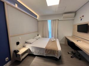 Postel nebo postele na pokoji v ubytování Hotel Ibirapuera Moema UH2003