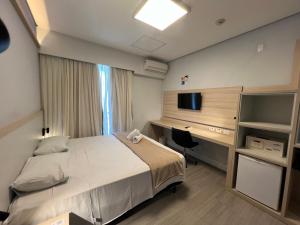 Postel nebo postele na pokoji v ubytování Hotel Ibirapuera Moema UH2003
