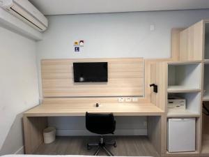 TV a/nebo společenská místnost v ubytování Hotel Ibirapuera Moema UH2003