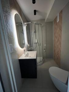 Et badeværelse på Nowoczesny Apartament Centrum przy PKP
