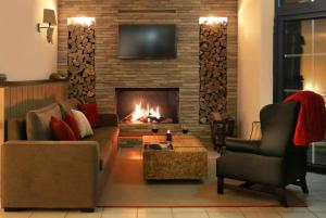 Zona d'estar a Landhotel Wittenbeck by ANS