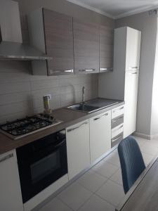 Kuchyň nebo kuchyňský kout v ubytování Residenza Le Coccinelle