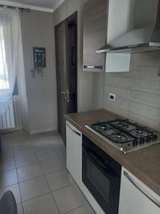Kuchyň nebo kuchyňský kout v ubytování Residenza Le Coccinelle
