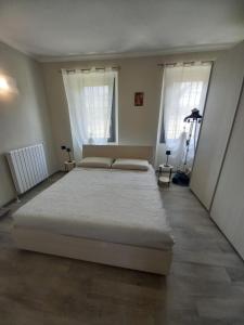 Postel nebo postele na pokoji v ubytování Residenza Le Coccinelle