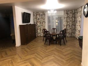 a dining room with a table and chairs at Wind Mood in Klebiškis