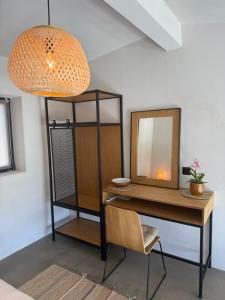a dressing table with a mirror and a chair at STELIA Villa Halkidiki in Kallithea Halkidikis