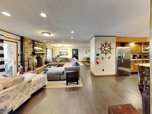 a large living room with a couch and a refrigerator at Sunset Cove in Dandridge