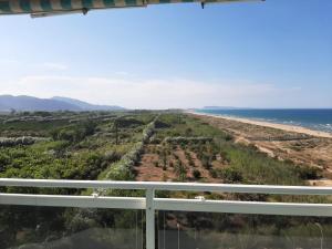 a view of the beach from the balcony at Apartamento Aiguablava Playa de Gandía in Playa de Gandia +2 photos