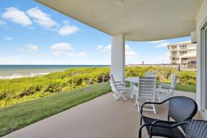 a view of the beach from the porch of a house at HP 16E Beach Treat by 30A Escapes in Rosemary Beach +19 photos