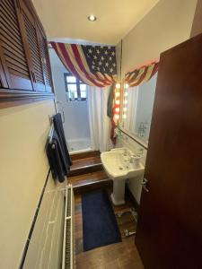 a small bathroom with a sink and a mirror at LiverpoolPenny Lane in Liverpool +32 photos