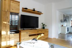 TV a/nebo společenská místnost v ubytování Ferienwohnung Rauchenberger