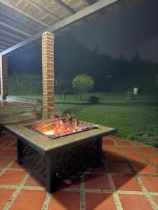 a fire pit on a table in a patio at Finca Buena Vista in Santa Elena