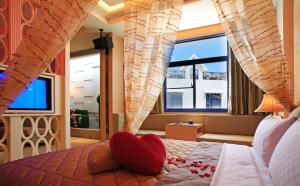 Postel nebo postele na pokoji v ubytování Blue Coast Spa Motel