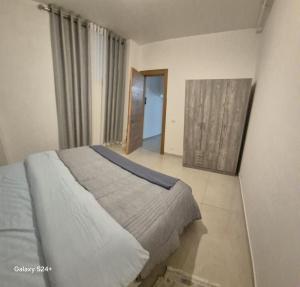 a bedroom with a large bed in a room at Aley Pilot Residence in Aley