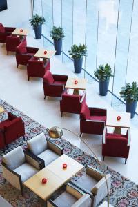 a row of tables and chairs in a lobby at Taj Bangalore in Devanahalli-Bangalore