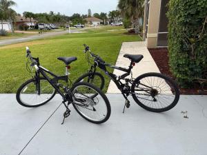 two bikes parked next to each other on a sidewalk at The Elegant Suite in Shared House in Cape Coral