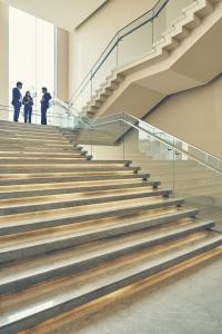 a group of people standing on stairs in a building at Taj Bangalore in Devanahalli-Bangalore