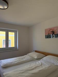 Łóżko lub łóżka w pokoju w obiekcie Appartement Berger