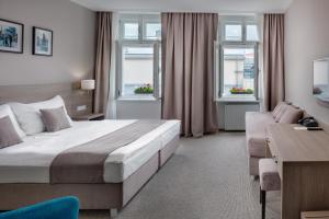 Posteľ alebo postele v izbe v ubytovaní Hotel Florenc