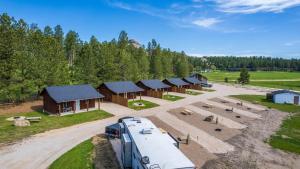 a truck parked in front of a group of buildings at Gold Valley Camp Cabin 1 in Custer