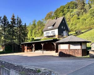 a large house on a hill with a building at Smart Resorts B&B 3 BB 1003 in Winterberg