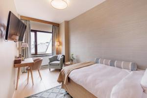 TV a/nebo společenská místnost v ubytování Home Hotel Wellington