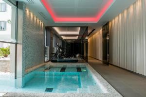 a swimming pool in the middle of a building at Palazzo Castri 1874 Hotel & Spa in Florence