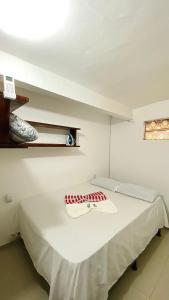 Giường trong phòng chung tại Aconchego Praia da Concha, Ilhéus - BA