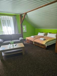 Voodi või voodid majutusasutuse Guest House Pod Lesem Merklín toas