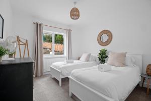 Postel nebo postele na pokoji v ubytování Bay View Luxury Stays - Southdown