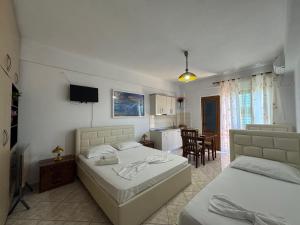 Ένα ή περισσότερα κρεβάτια σε δωμάτιο στο Vila Hergi