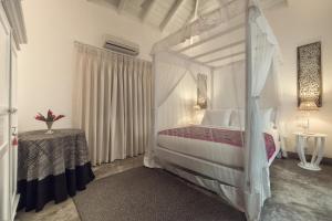Postel nebo postele na pokoji v ubytování Taru Villas Mawella - Tangalle