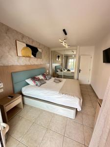 a bedroom with a large bed in a room at Royal Palace- Granada Park in Arona +19 photos