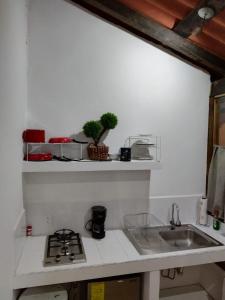 a kitchen with a sink and a counter top at Casa en el Centro de Taxco in Taxco de Alarcón