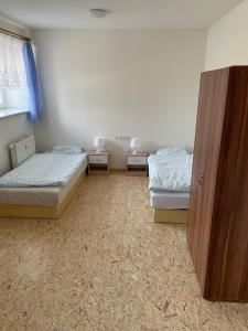 Postel nebo postele na pokoji v ubytování Apartmány J L A