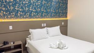 Postel nebo postele na pokoji v ubytování Hotel Mandino