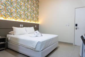 Postel nebo postele na pokoji v ubytování Hotel Mandino