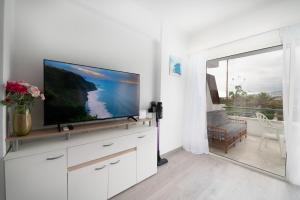 A television and/or entertainment centre at Angel's house at Club Atlantis