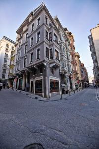 a large white building on a city street at Arart Hotel in Istanbul