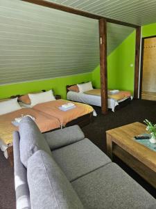 Voodi või voodid majutusasutuse Guest House Pod Lesem Merklín toas