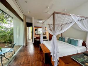 Calamansi Cove Villas 객실 침대
