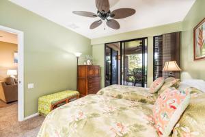 Ένα ή περισσότερα κρεβάτια σε δωμάτιο στο Big Island Waikoloa Fairways A-109 by Coldwell Banker Island Vacations +36 φωτογραφίες