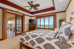 a bedroom with a bed with a view of the ocean at Big Island Waiulaula at Mauna Kea J201 by Coldwell Banker Island Vacations in Hapuna Beach +51 photos