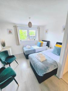 Ένα ή περισσότερα κρεβάτια σε δωμάτιο στο Peckham City Vibes 2BR with Wi-fi and Balcony